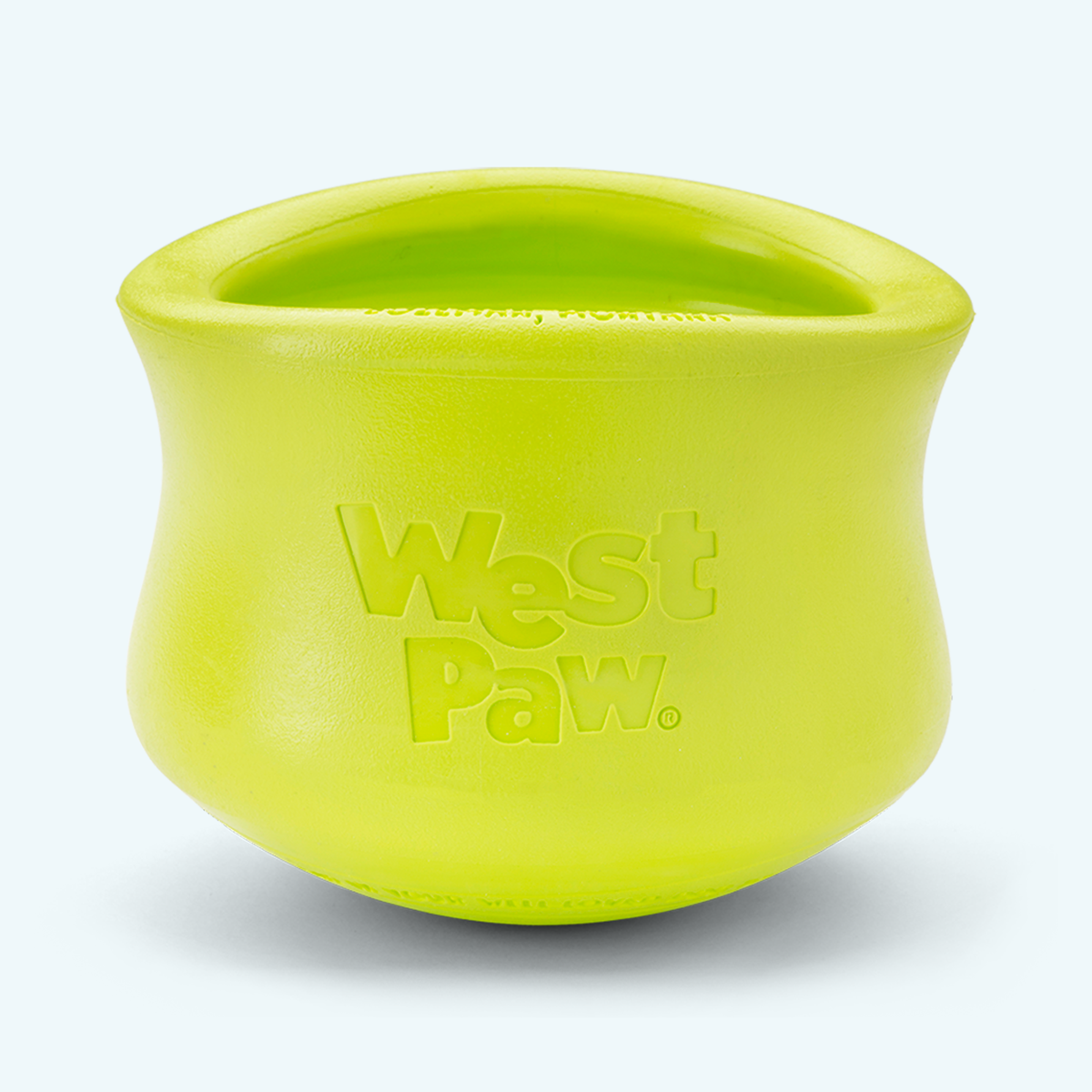 A green West Paw puzzle treat toy designed for dogs.