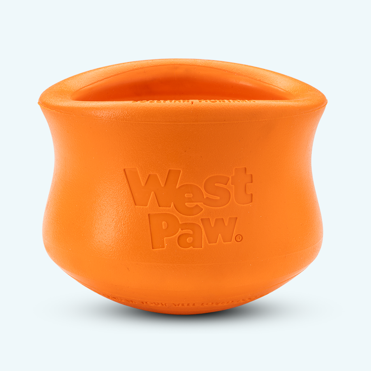 An orange West Paw puzzle treat toy designed for dogs.